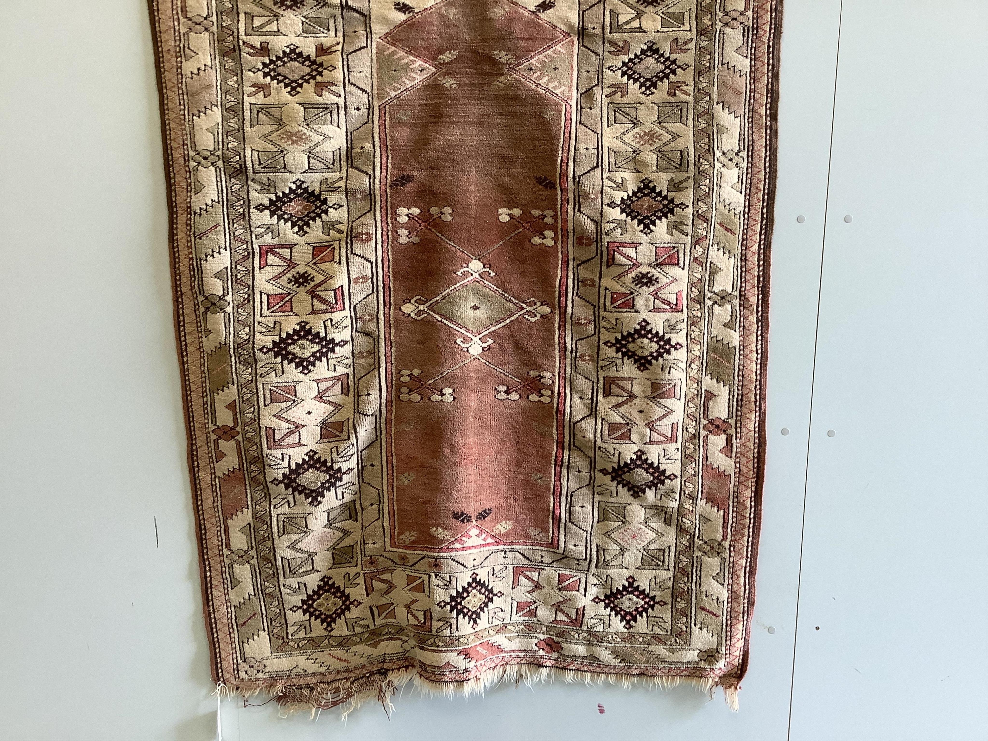 A Caucasian design red ground prayer rug, 193 x 124cm